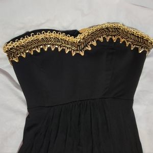 BEBE maxi sleeveless/backless black dress with gold accents